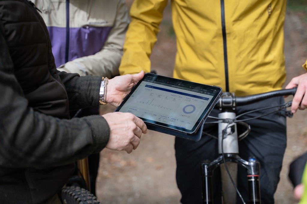 Team reviewing dashboard data directly on the trail