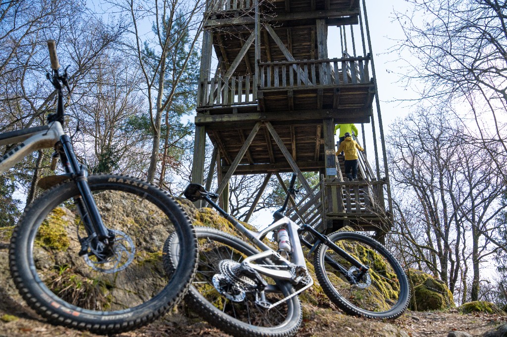 Mountain bikes at a lookout tower in spring